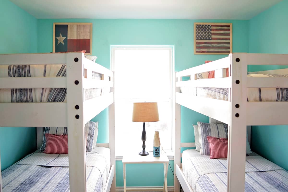 Bunk room with two sets of bunk beds