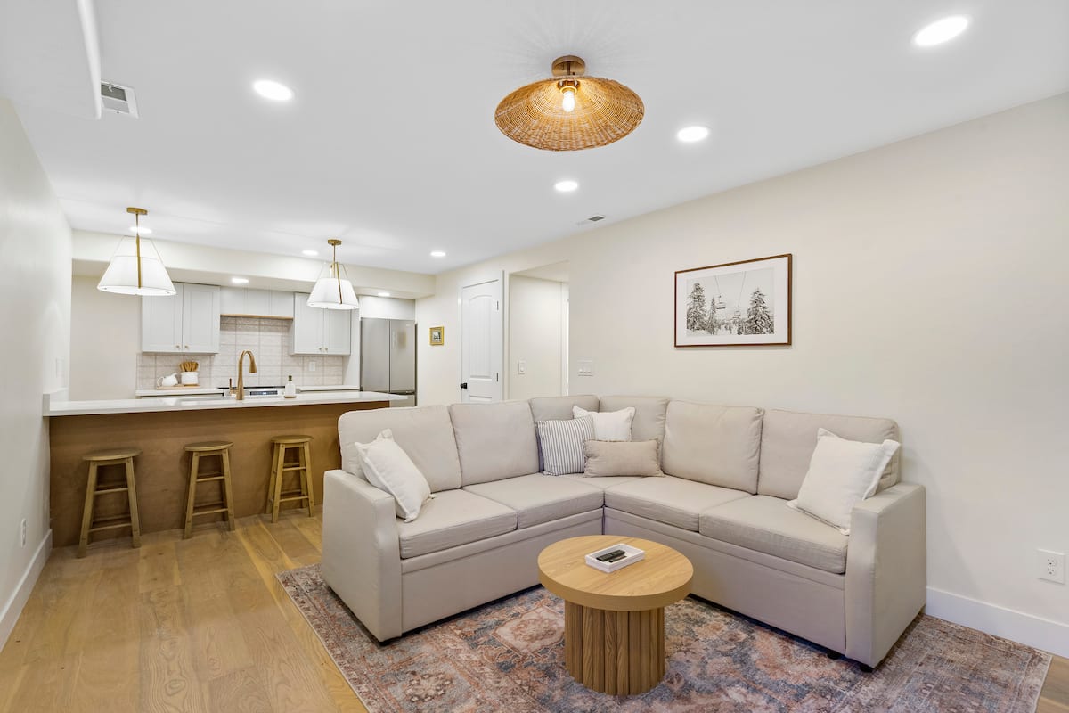 Open living area and kitchen island with bar stools